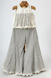 Dola Silk Top with Faux Mirror Embroidery embellished with Tassels paired with tissue Palazzo