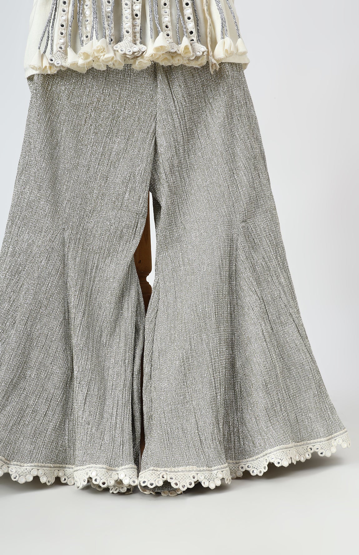 Dola Silk Top with Faux Mirror Embroidery embellished with Tassels paired with tissue Palazzo