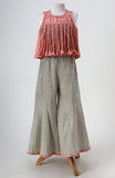 Dola Silk Top with Faux Mirror Embroidery embellished with Tassels paired with tissue Palazzo