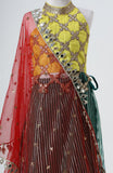 Raw silk blouse with faux mirror lace detailing and organza lehnga with gota detailing and mirrorwork border alongwith a soft net emb dupatta with pearl emb border