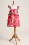 Printed cotton sleeveless dress. Detailed with frils on shoulder and waist