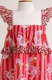 Printed cotton sleeveless dress. Detailed with frils on shoulder and waist