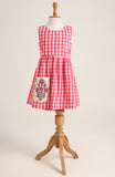 Cotton printed sleevesless checks Dress. Detailed with front Pocket and Back Criss Cross Wrap