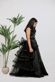 BLACK SATIN EMBOIDERED GOWN WITH DETACHABLE  RUFFLE DRAPE