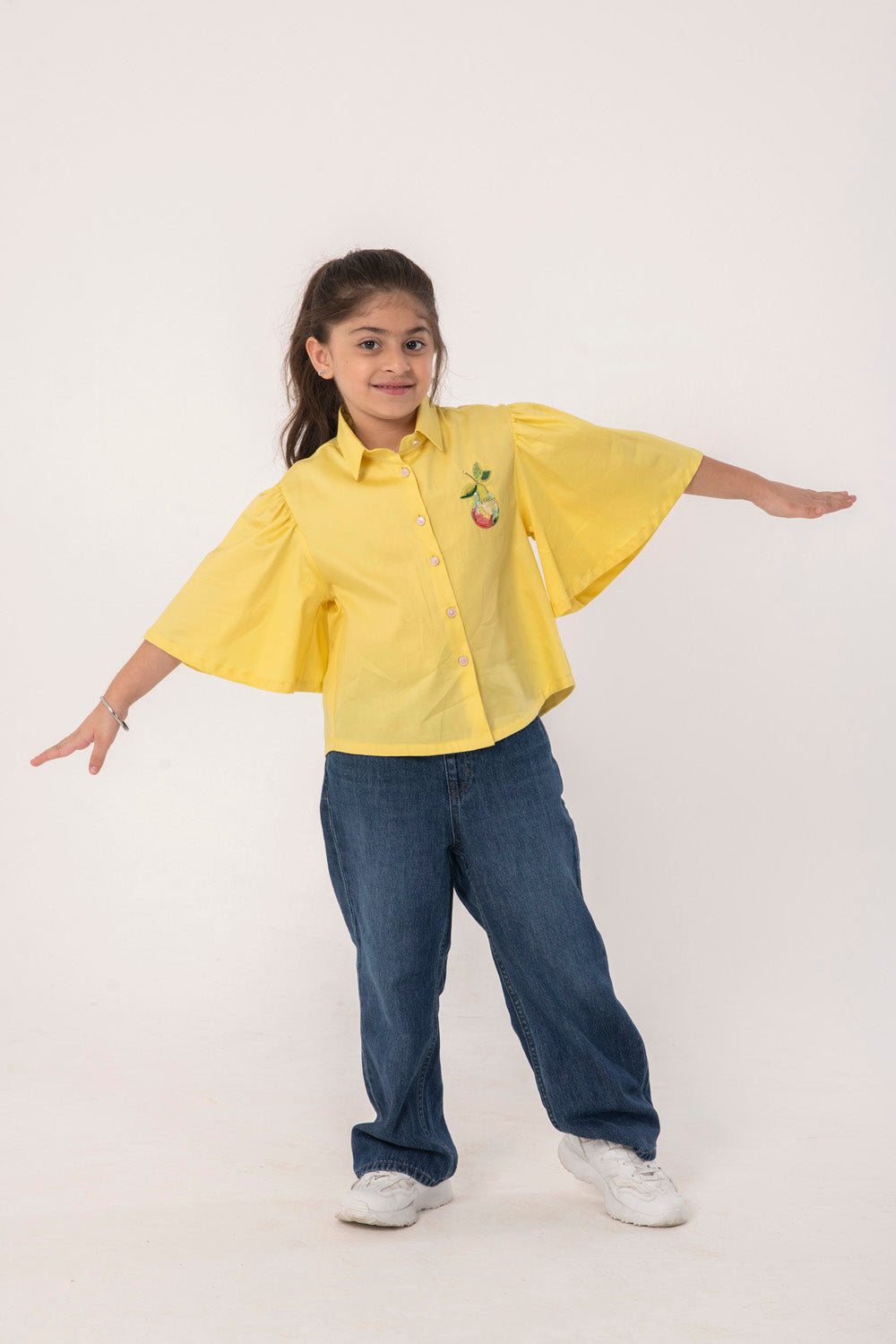 YELLOW SHIRT WITH PEAR EMBROIDERY MOTIF ON CHEST. FANCY BELL SLEEVES