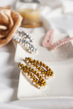 Pair Of White Gravel Gem Hair Clips Gold